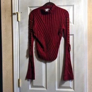 Beautiful ribbed burgundy sweater with bell sleeves. Size 8 to 10 excellent cond